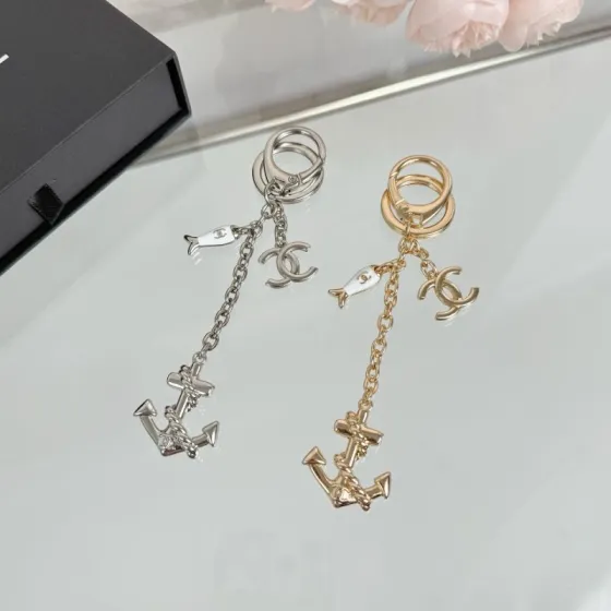Chanel CC Nautical Anchor Fish Charm Key Holder pendant Gold-tone metal with white enamel fish charm Silver-tone metal with white enamel fish charm 10cm total drop length