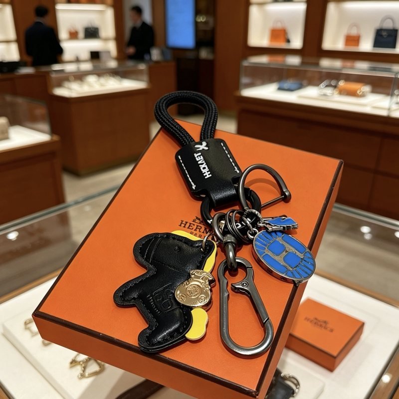 Hermes Rodeo Horse Charm Keychain pendant Black leather gunmetal hardware blue enamel yellow leather accent gold-tone charm 12cm total length