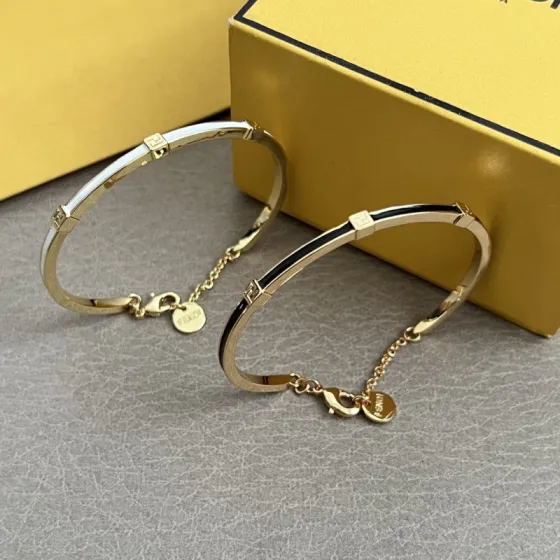Fendi FF Logo Enamel Bangle bracelet Gold-tone metal with white black enamel accents 17cm