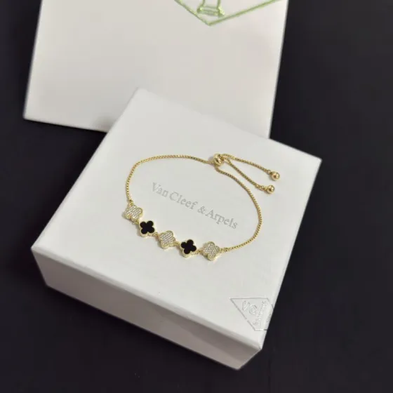 Van Cleef Arpels Alhambra bracelet yellow gold metal black onyx clover motifs clear diamond-paved clover motifs adjustable sliding bolo chain fits 15-20cm wrist