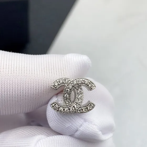 Chanel CC Crystal Stud Earrings earrings silver-tone metal with clear crystals gold-tone metal with clear crystals 1cm diameter