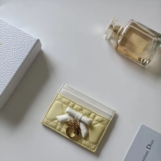 Christian Dior Lady Dior Bow Charm Card Holder brooch Pale yellow lambskin leather with white trim white fabric bow rose gold-tone metal hardware 10 5 8 0 5cm