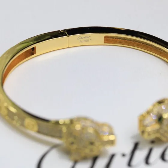 Cartier Panthere de Cartier bracelet 18K yellow gold set with diamonds black onyx green emerald 17