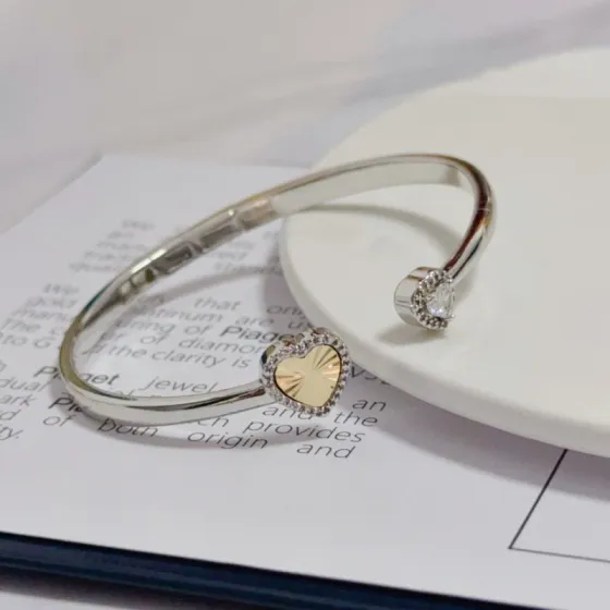 Piaget Heart Open Cuff Bangle bracelet Silver-toned white gold metal yellow gold heart accent clear diamond accents 16cm inner circumference