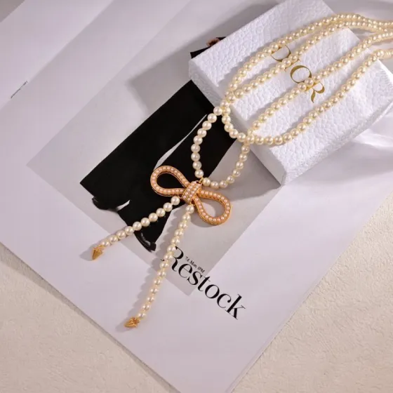 Dior Bow Pearl Lariat necklace Gold-tone metal with cream white faux pearls 80cm with 5cm extender chain