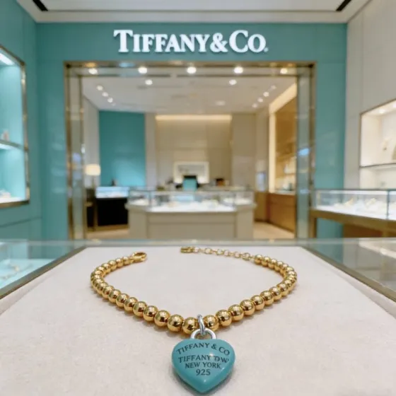 Tiffany Co Return to Tiffany Heart Tag Bead Bracelet bracelet gold-tone metal with signature Tiffany Blue enamel heart charm 7 inches