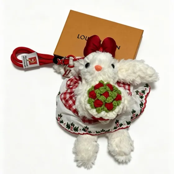 Louis Vuitton Anger Forest Plush Bunny Keychain pendant Red metal hardware white plush red fabric accents green and red crocheted bouquet orange nose black eyes 18cm total length with 10cm wrist strap
