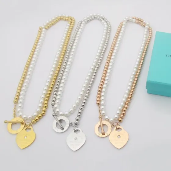Tiffany Co Return to Tiffany Heart Tag Pearl Toggle Necklace necklace Sterling silver metal with white freshwater pearls and a single diamond accent on the heart tag variants also available in yellow gold and rose gold metal with white pearls 16 inches