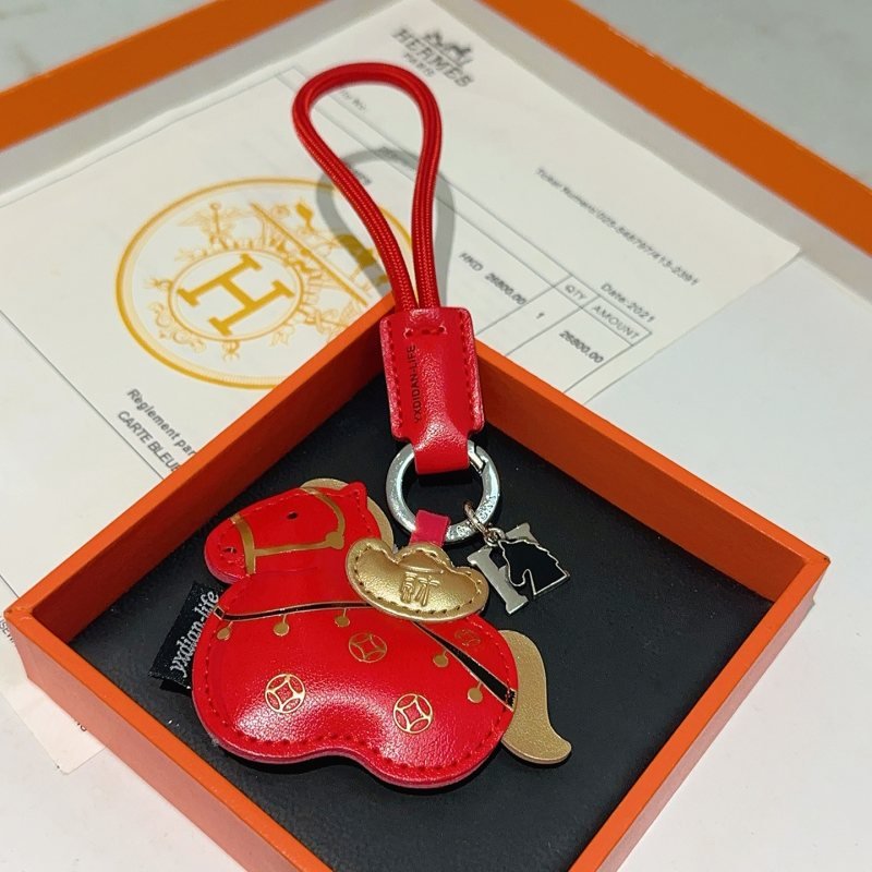 Hermes Lucky Horse Wealth Ingot Bag Charm pendant Red leather with gold metallic accents silver hardware black enamel detail 12cm total strap length