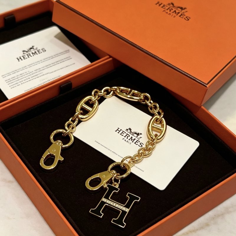 Hermes H Logo Chaine d Ancre Bag Charm Keychain pendant Gold-tone metal with black enamel and clear crystal accents 16cm