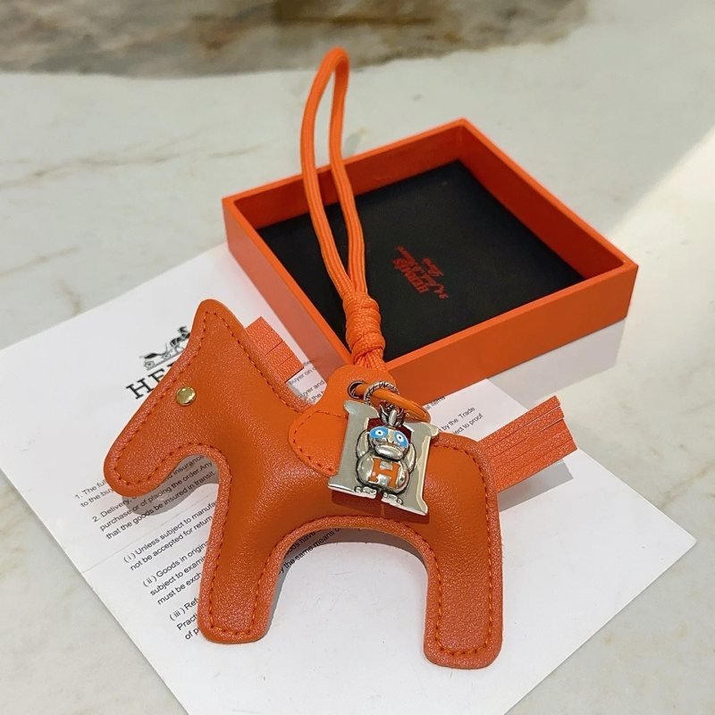Hermes Rodeo Pegase Horse Charm with H Monkey Pendant pendant Orange leather with silver-tone metal blue and orange enamel accents gold-tone rivet 8cm