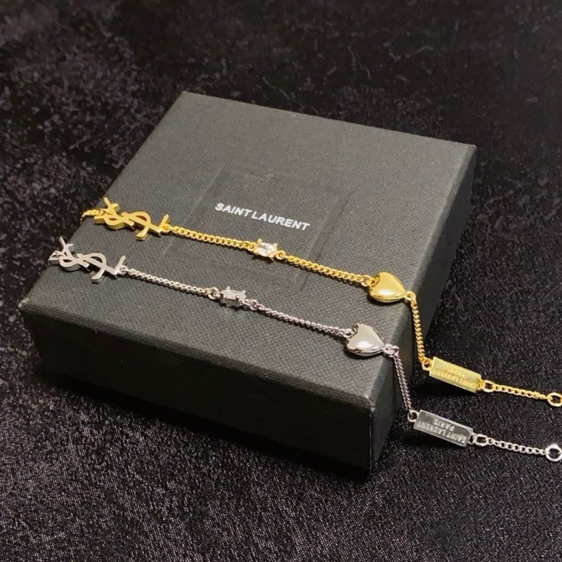 Saint Laurent Cassandre Heart Charm bracelet gold-tone metal with clear cubic zirconia accent 16cm with 3cm extender