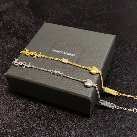 Saint Laurent Cassandre Heart Charm bracelet gold-tone metal with clear cubic zirconia accent 16cm with 3cm extender