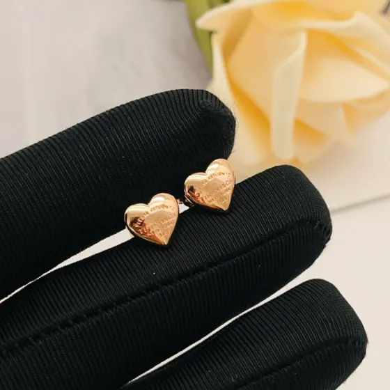 Tiffany Co Return to Tiffany Mini Heart earrings Rose gold-toned metal with engraved text detailing 8mm stud diameter