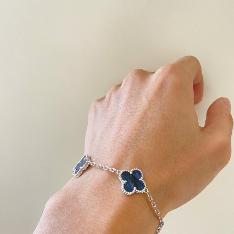 Van Cleef Arpels Alhambra bracelet silver-toned metal with dark blue pietersite clover motifs 18cm