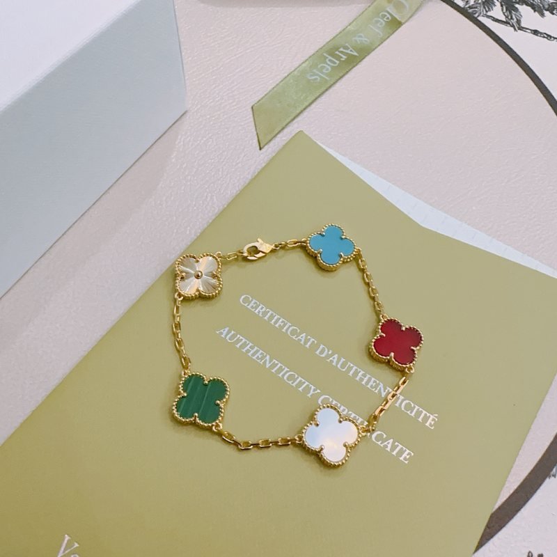 Van Cleef Arpels Alhambra bracelet Yellow gold metal with multi-color clover inlays turquoise blue carnelian red malachite green white mother-of-pearl and gold guilloche clover 19cm