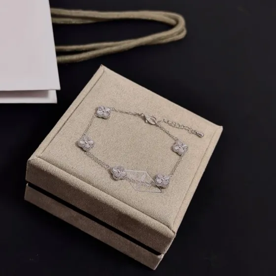 Van Cleef Arpels Alhambra bracelet silver white gold with clear diamond accents 19cm