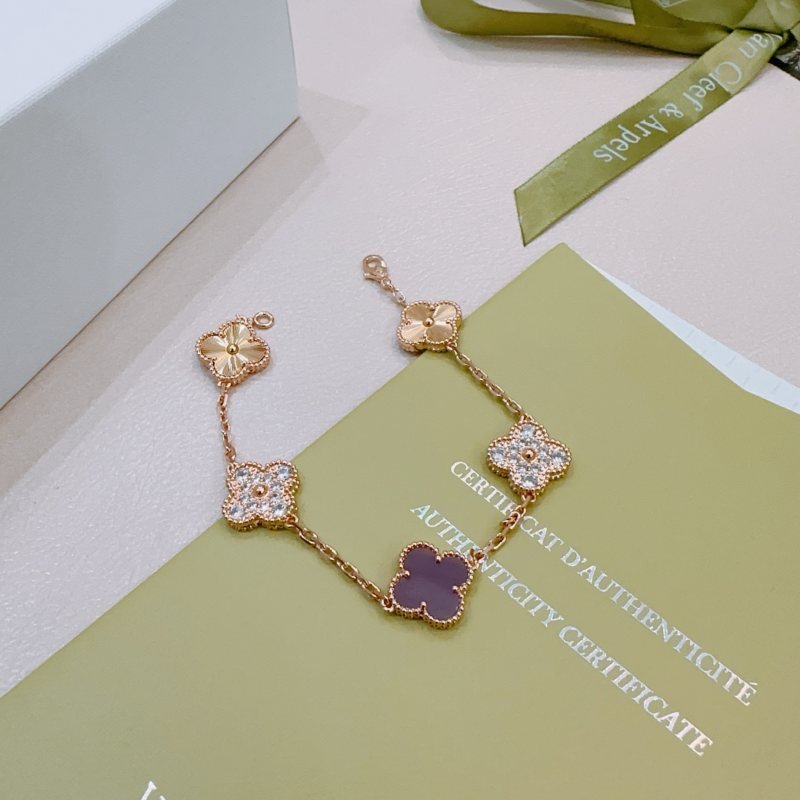 Van Cleef Arpels Alhambra bracelet Rose gold metal with clear diamond accents and purple stone clover motifs 17cm