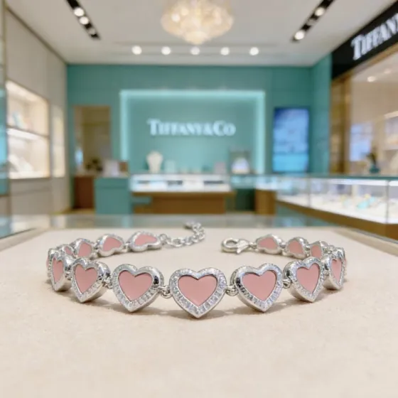 Tiffany Co Heart Link bracelet silver-toned metal with pink enamel and clear diamond-like accent stones 18cm adjustable
