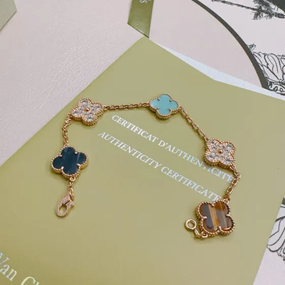 Van Cleef Arpels Alhambra bracelet Rose gold with turquoise dark blue stone tiger s eye and clear diamond accents 17cm