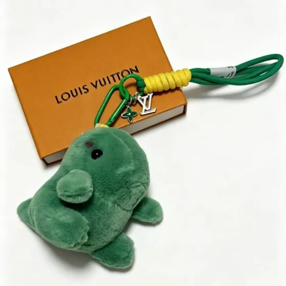 Louis Vuitton Anger Forest Plush Dinosaur Keychain pendant green plush yellow cord wrap silver-tone metal hardware green cord black eye detail 12cm total strap length