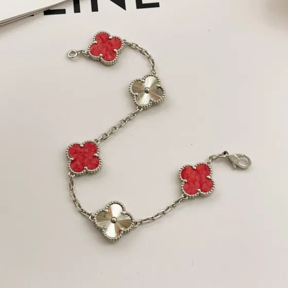 Van Cleef Arpels Vintage Alhambra bracelet Silver-toned metal with red stone inlays and guilloche silver clover motifs 18cm