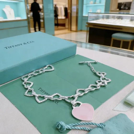 Tiffany Co Heart Link Toggle Bracelet with Pink Enamel Heart Tag bracelet silver-toned metal with clear pave accents and pink enamel heart charm 7 inches