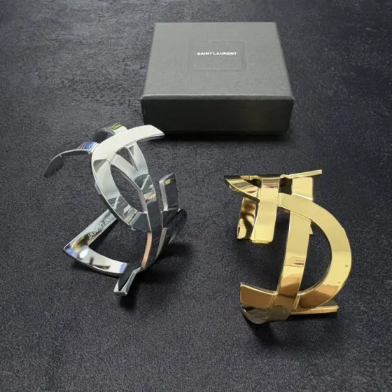 Saint Laurent Cassandre YSL Monogram Cuff bracelet Polished gold-tone metal silver-tone metal variant also available no gemstones One Size open cuff standard 6 5 inch inner circumference
