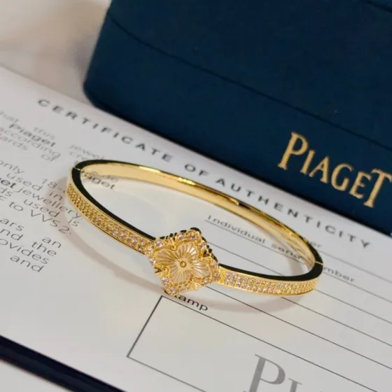 Piaget Rose bracelet yellow gold with clear diamond accents and mother-of-pearl flower detail 17cm inner circumference
