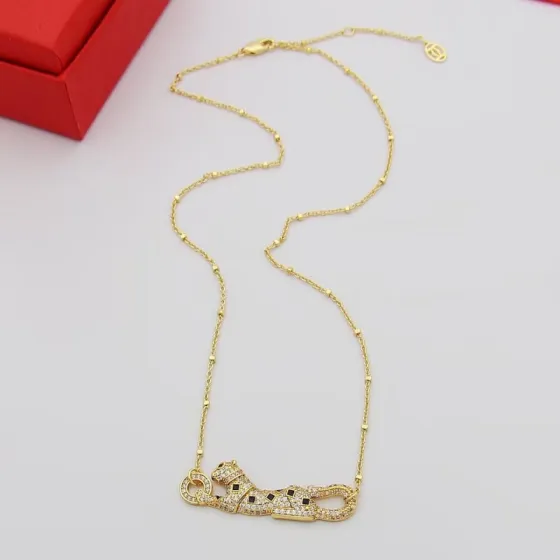Cartier Panthere de Cartier necklace 18k yellow gold paved clear diamonds black onyx spots tsavorite garnet eyes 42cm