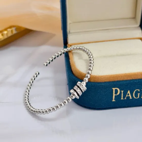 Piaget Possession bracelet silver-toned white gold with clear diamond accents and black enamel detailing 17cm