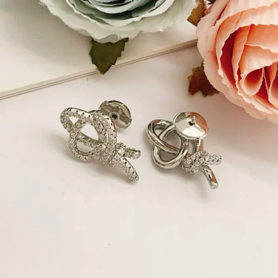 Tiffany Co Knot earrings silver-toned metal with clear diamond pave 1 5cm stud length