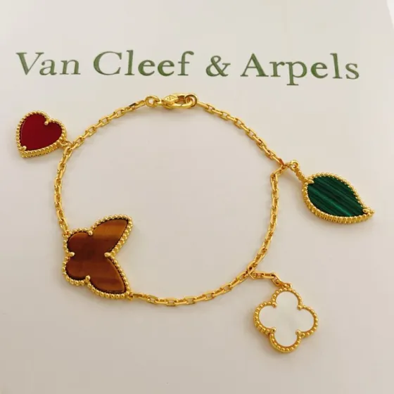 Van Cleef Arpels Lucky Alhambra bracelet Yellow gold with red carnelian green malachite brown tiger s eye white mother-of-pearl 19cm