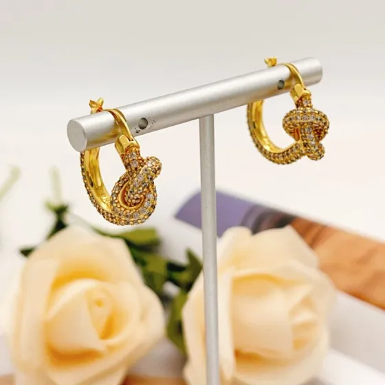 Tiffany Co Knot earrings yellow gold metal with clear pave diamonds 15mm hoop diameter