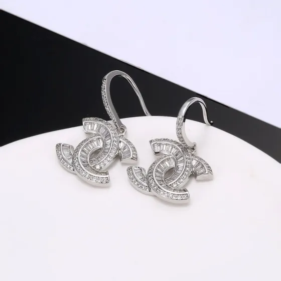Chanel CC Baguette Crystal Drop Earrings earrings Gold-toned metal with clear baguette and round-cut crystals 2 5cm total drop length