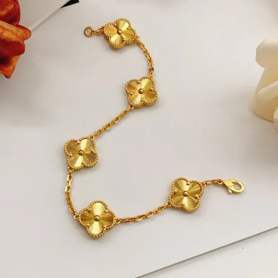 Van Cleef Arpels Vintage Alhambra bracelet 18k yellow gold with guilloche engraved four-leaf clover motifs 18cm
