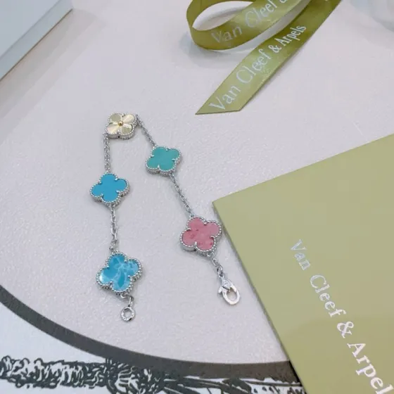 Van Cleef Arpels Alhambra bracelet Silver-toned metal with gold accent multi-colored clover inlays turquoise blue teal pink sky blue marbled blue 17cm