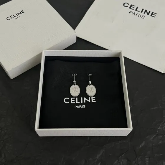 Celine Triomphe Oval Medallion Drop Earrings earrings Available in polished silver-tone metal and polished gold-tone metal with engraved Triomphe logo detailing One Size standard post drop length
