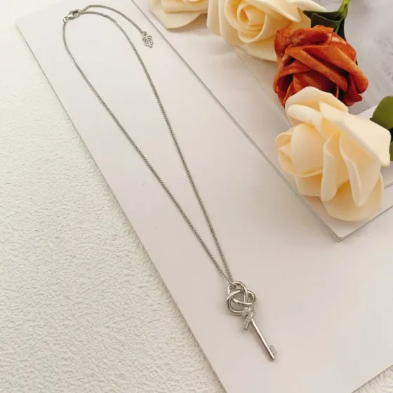 Tiffany Co Keys Knot Key Pendant necklace sterling silver with clear diamond accents 18 inches