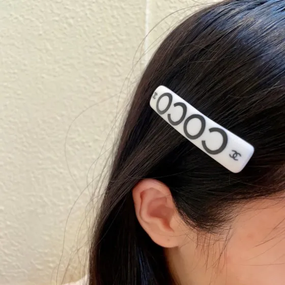 Chanel COCO brooch white base with black printed logos and lettering 6cm