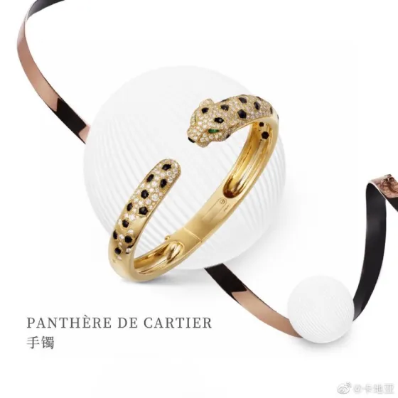 Cartier Panthere de Cartier bracelet 18K yellow gold set with diamonds black onyx spots tsavorite garnet eyes 17
