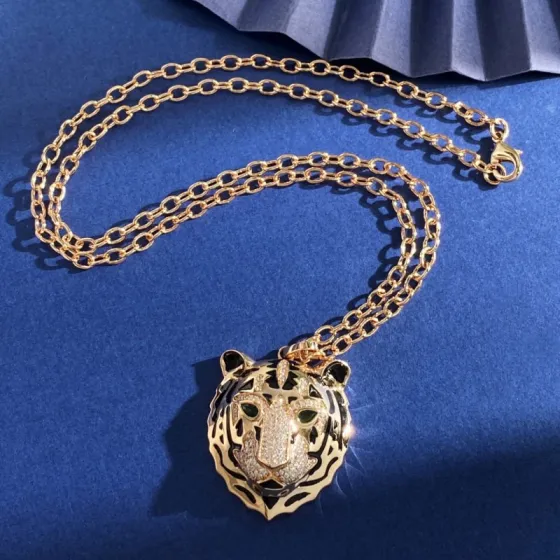 Cartier Panthere de Cartier Tiger Head Pendant necklace Yellow gold with black enamel pave-set clear diamonds and green gemstone eyes 60cm