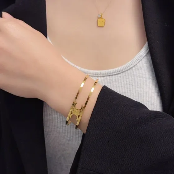 Celine Triomphe Open Cuff bracelet gold-tone metal no accent stones adjustable open cuff fits 15-18cm wrist circumference