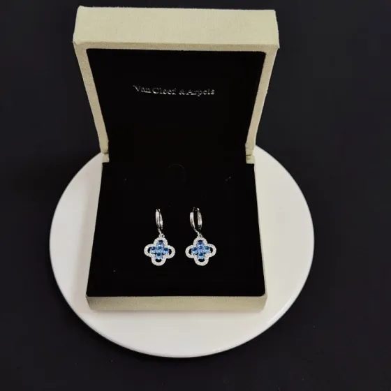 Van Cleef Arpels Alhambra earrings silver-toned white metal blue gemstones clear diamond accents 12mm hoop diameter 10mm clover charm
