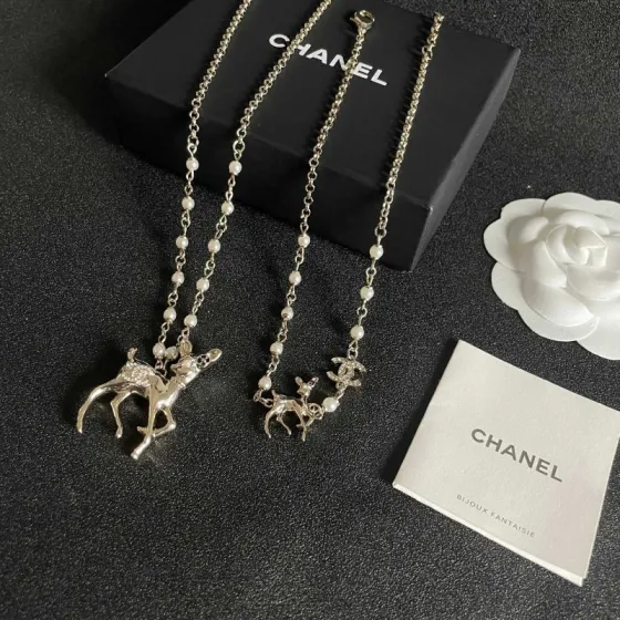 Chanel CC Logo Bambi Deer Pearl Pendant necklace Light gold-tone metal white faux pearls clear crystals black enamel accents 42cm