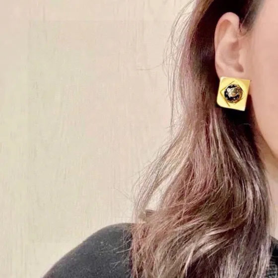 Celine Square Star Globe Stud Earrings earrings Gold-tone metal with silver-tone star embossed center 1 5cm width