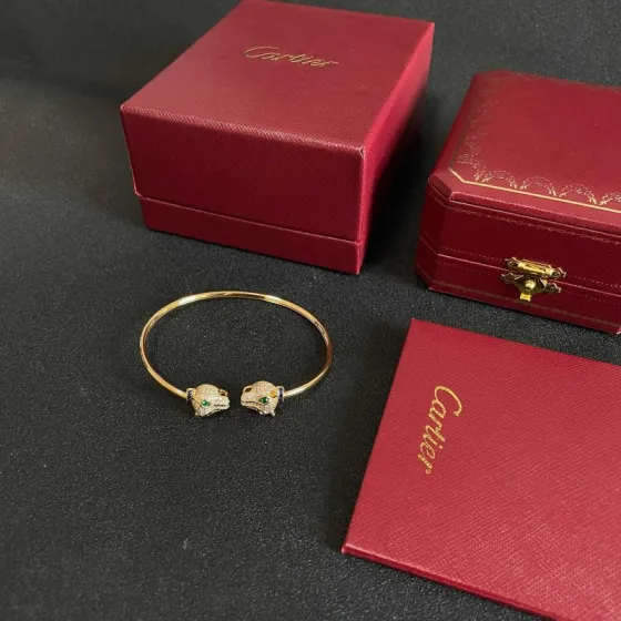 Cartier Panthere de Cartier bracelet 18k yellow gold pave clear diamonds emerald green eyes blue sapphire accents 17