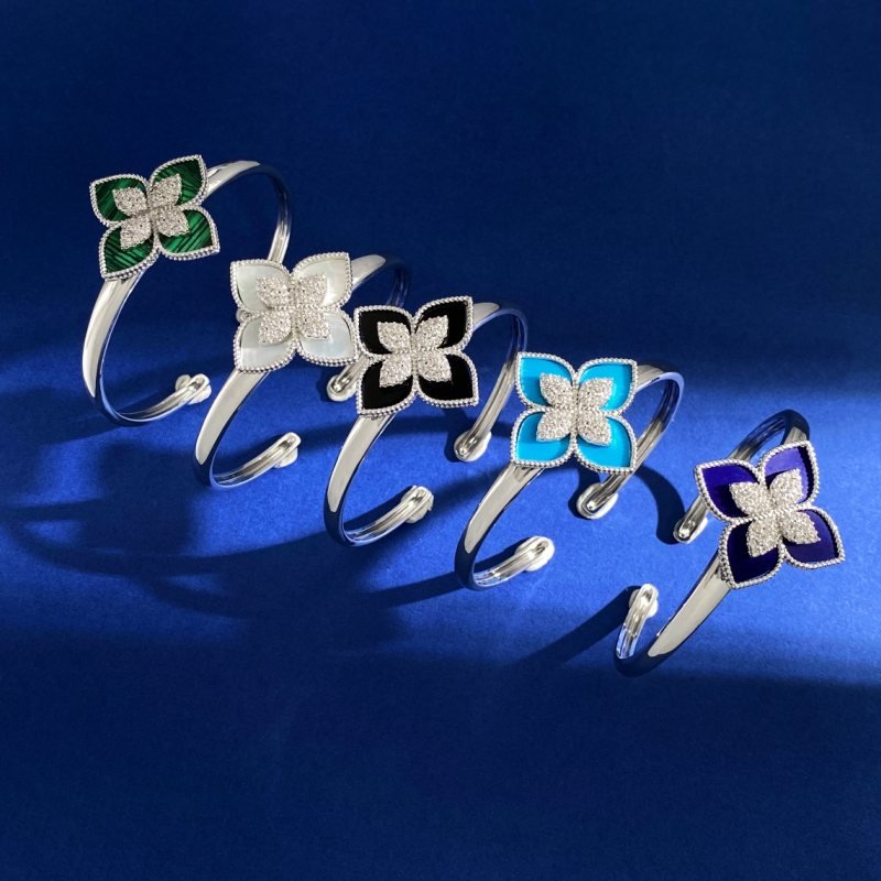Van Cleef Arpels RC80 bracelet silver-toned metal with diamond-paved flower centers available with green malachite white mother-of-pearl black onyx turquoise blue and dark blue lapis lazuli petal inlays 17cm