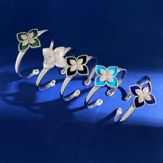 Van Cleef Arpels RC80 bracelet silver-toned metal with diamond-paved flower centers available with green malachite white mother-of-pearl black onyx turquoise blue and dark blue lapis lazuli petal inlays 17cm