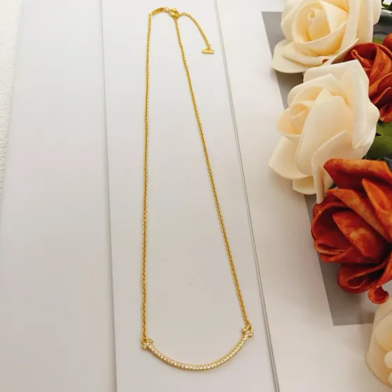 Tiffany Co T Smile necklace yellow gold with clear diamond accents 16-18 inches adjustable